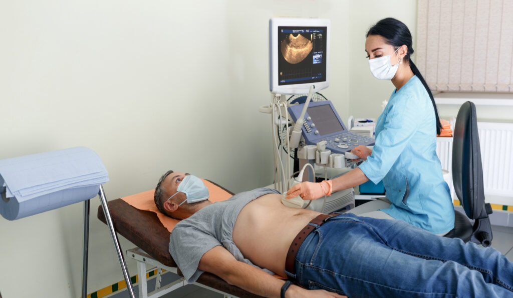 Healthcare professional performing an abdominal ultrasound